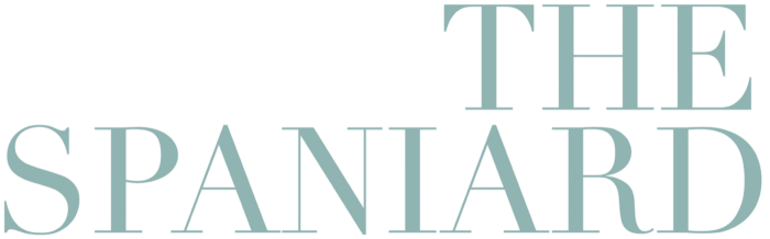 a sign on a building with a picture of a man on it