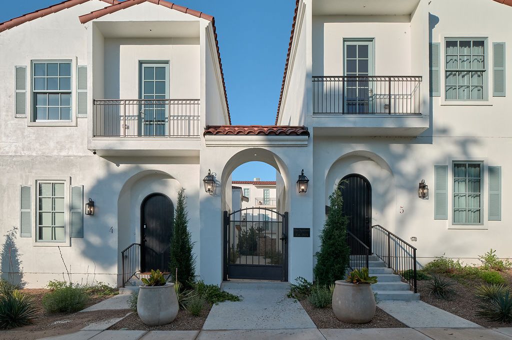a white house with a blue door and white walls