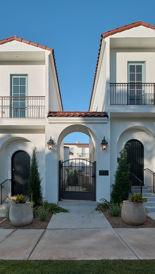 a white house with a blue door and white walls