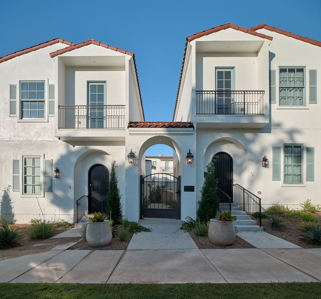 a white house with a blue door and white walls