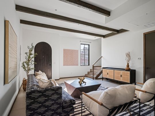 a living room with a large bed and a large window