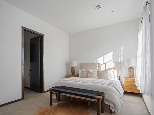 a bedroom with a bed and a dresser