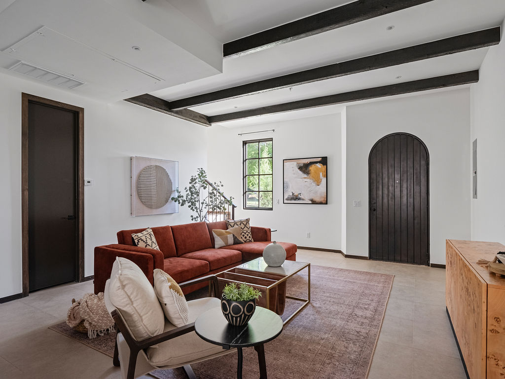 a living room filled with furniture and a couch