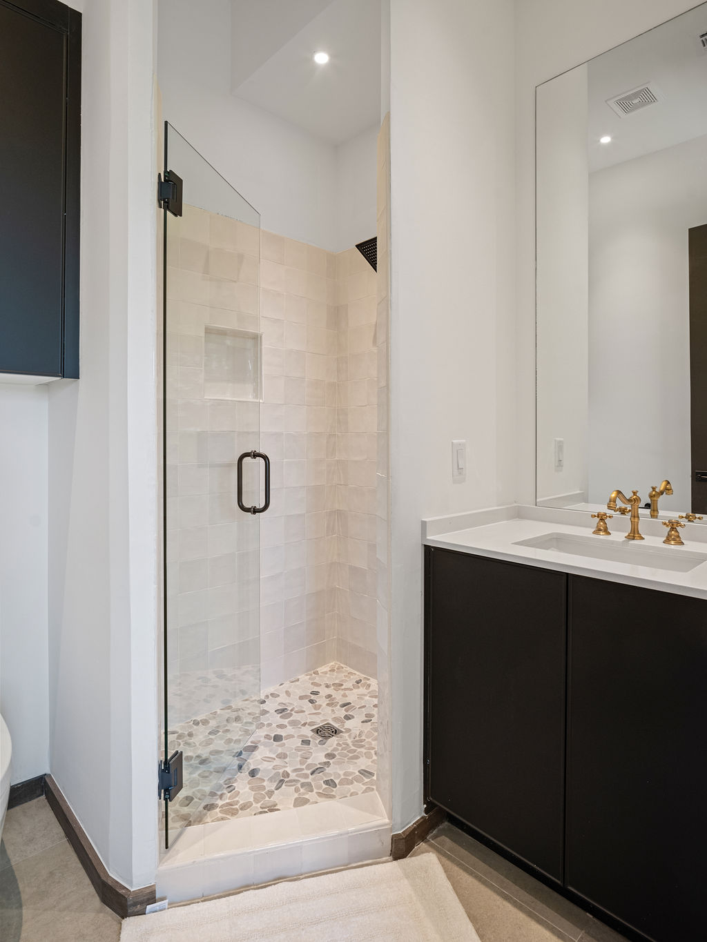 a bathroom with a bath tub, toilet and sink