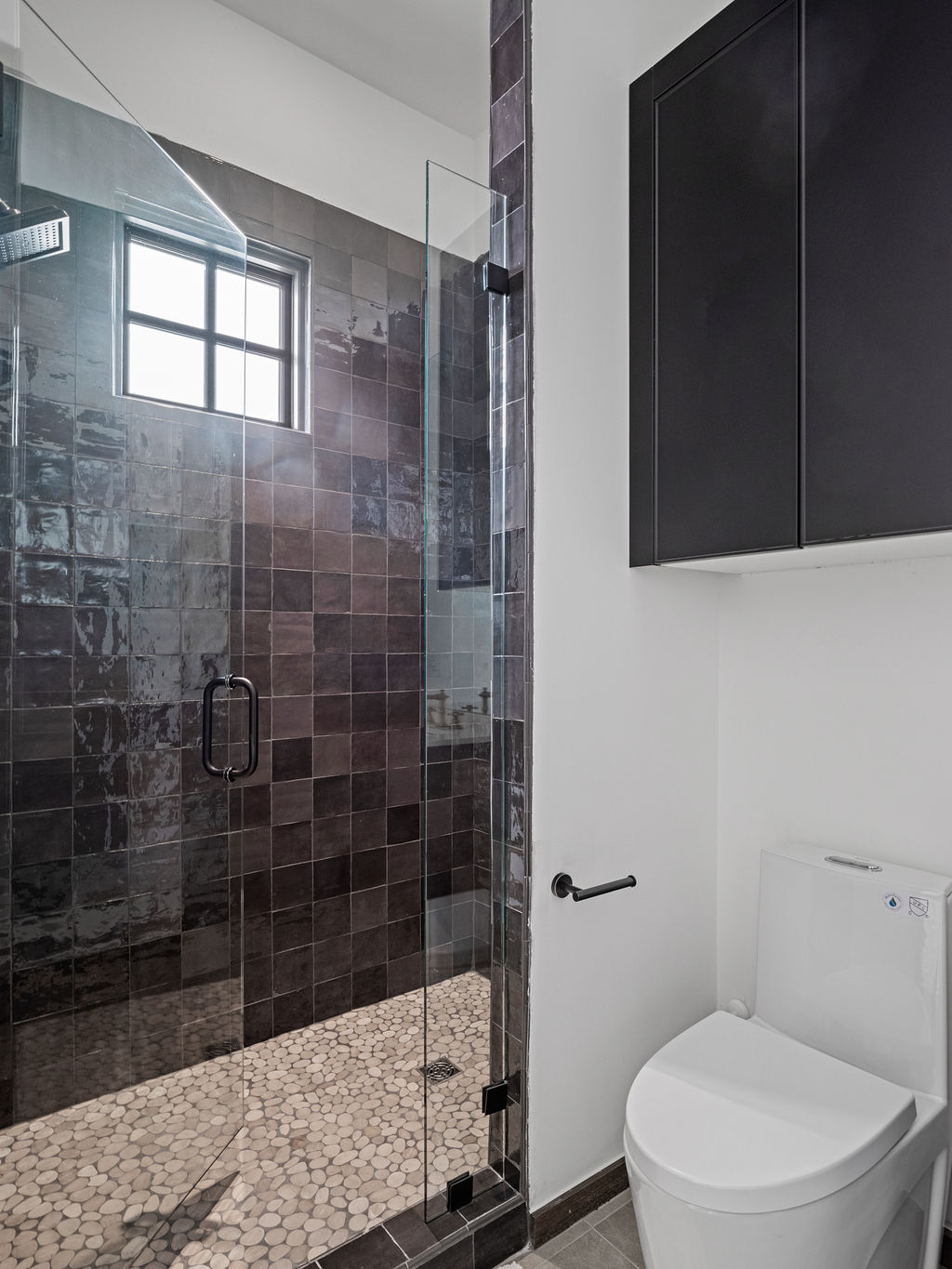 a bathroom with a toilet, sink, and bathtub