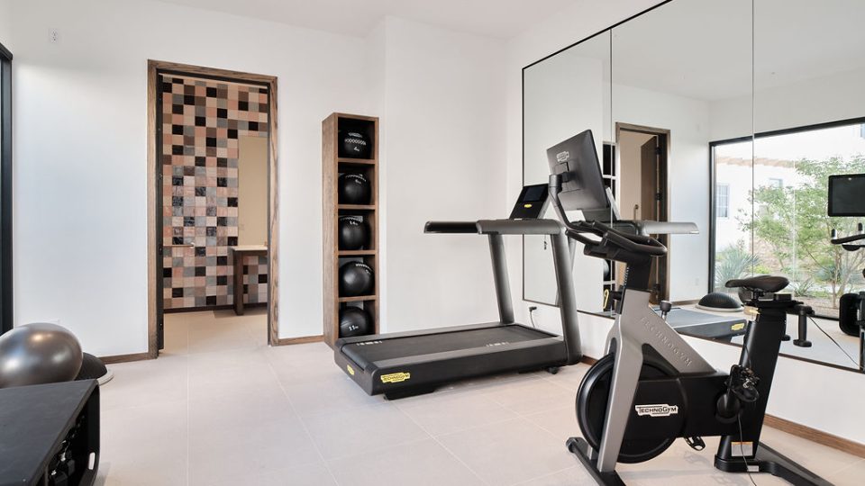 a living room with a chair and a tv